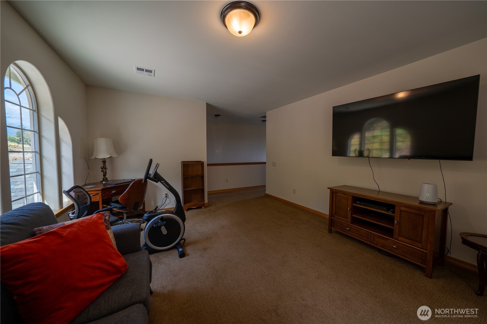 212 Maletti Hill Road Port Angeles, WA 98362 - Photo 36 of 37 a view of a livingroom with furniture and a flat screen tv