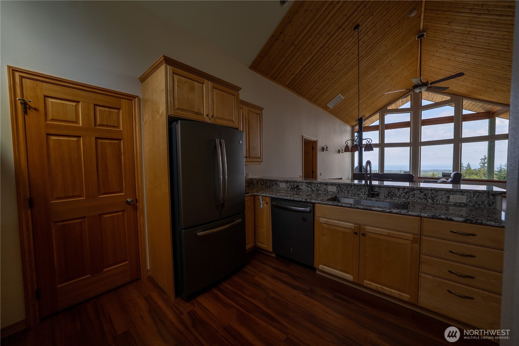 212 Maletti Hill Road Port Angeles, WA 98362 - Photo 9 of 37 a kitchen with granite countertop stainless steel appliances and wooden cabinets