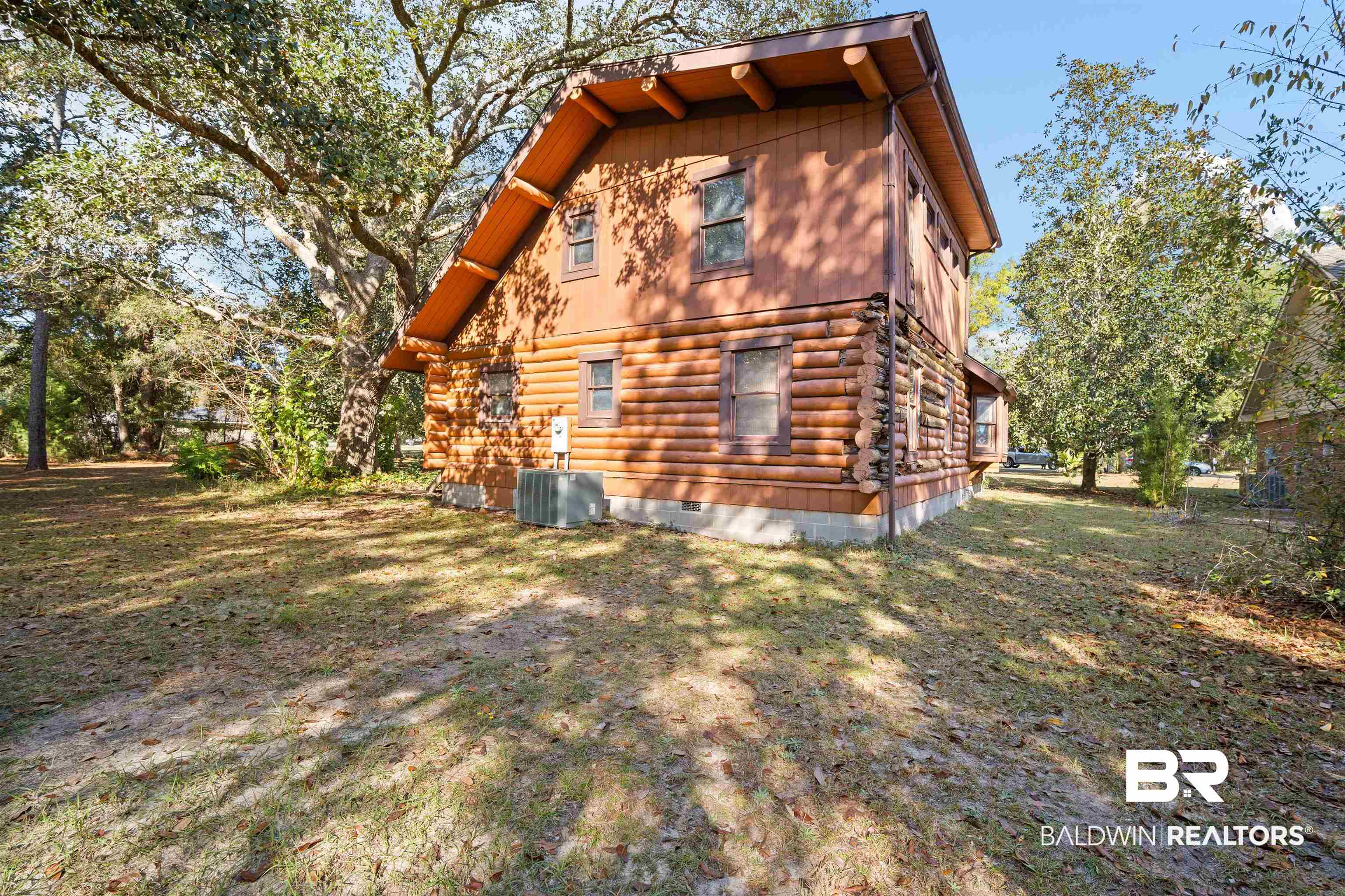 11236 Wren Avenue Fairhope, AL 36532 - Photo 24 of 35 Rear view of property featuring log exterior, a yard, and crawl space
