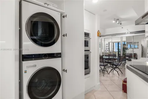 a view of a hallway with washer and dryer