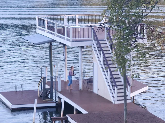 a view of a backyard with sitting area