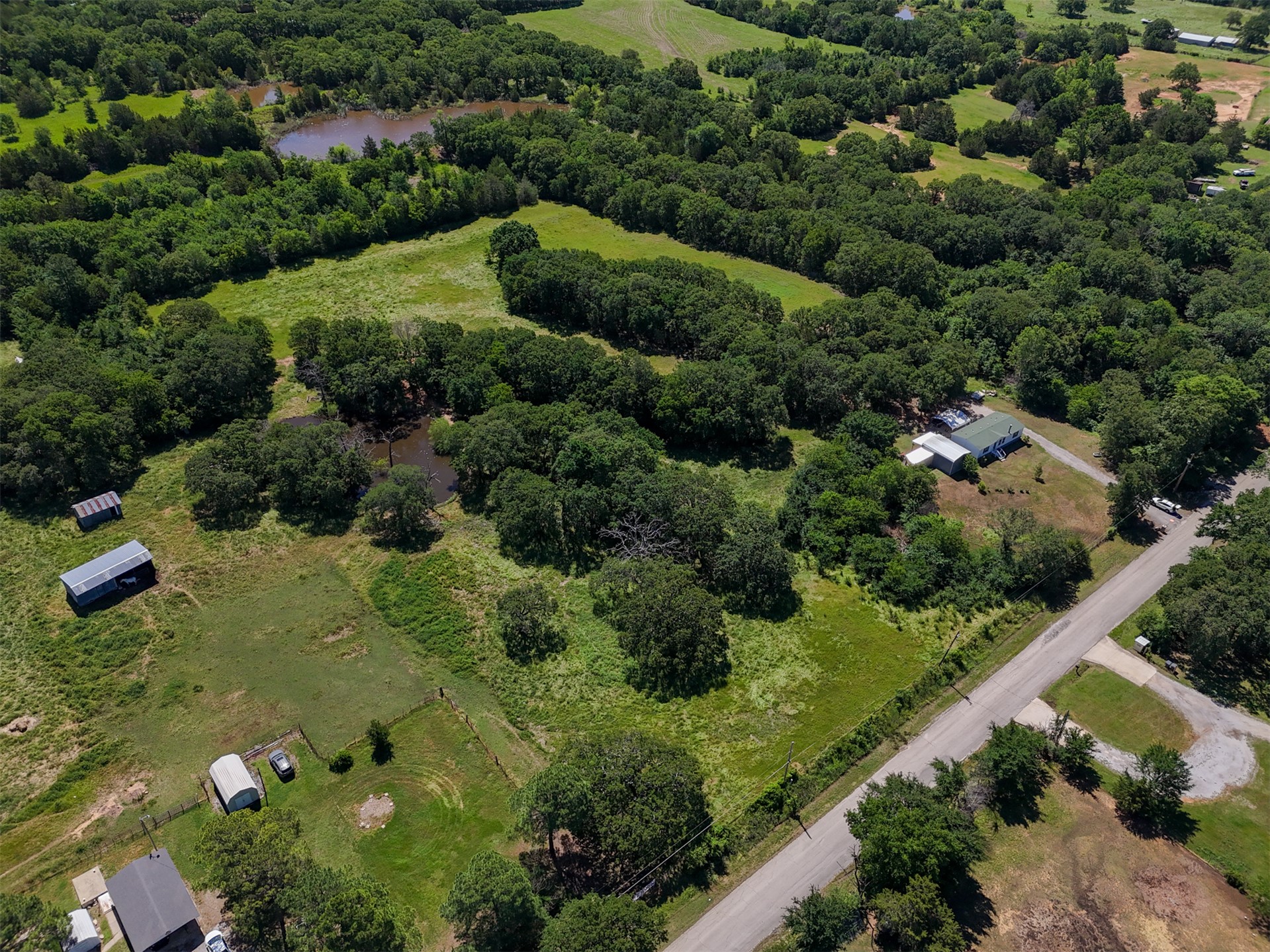 0 Harvey Road Ardmore, OK 73401 - Photo 9 of 10 Expansive green spaces with mature trees