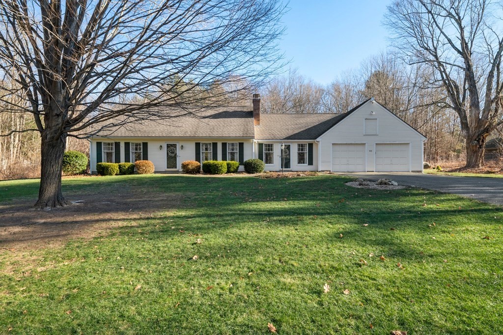 83 Thayer Road Monson, MA 01057 - Photo 1 of 42 a front view of a house with a yard and trees