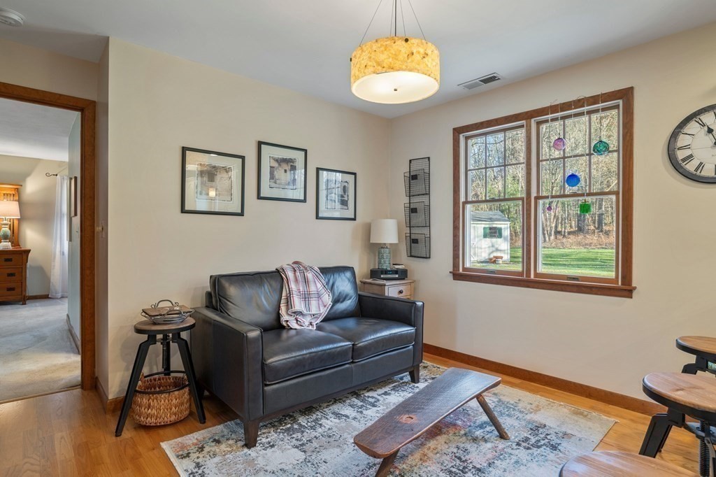 83 Thayer Road Monson, MA 01057 - Photo 17 of 42 a living room with furniture wooden floor and a window