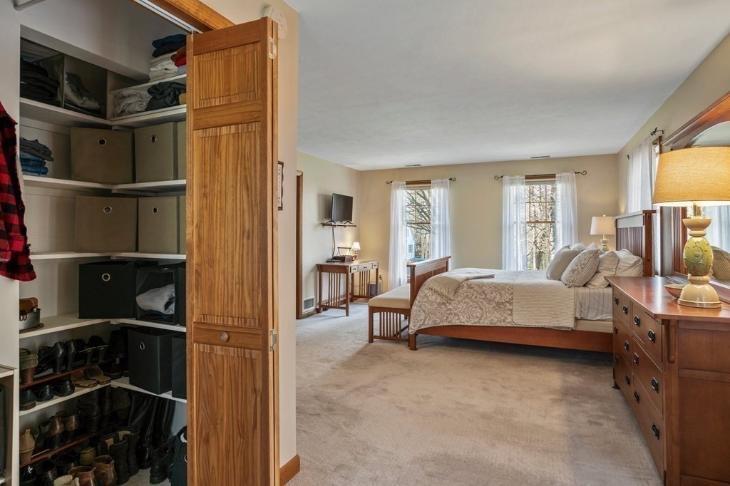 83 Thayer Road Monson, MA 01057 - Photo 20 of 42 a spacious bedroom with a bed and a window