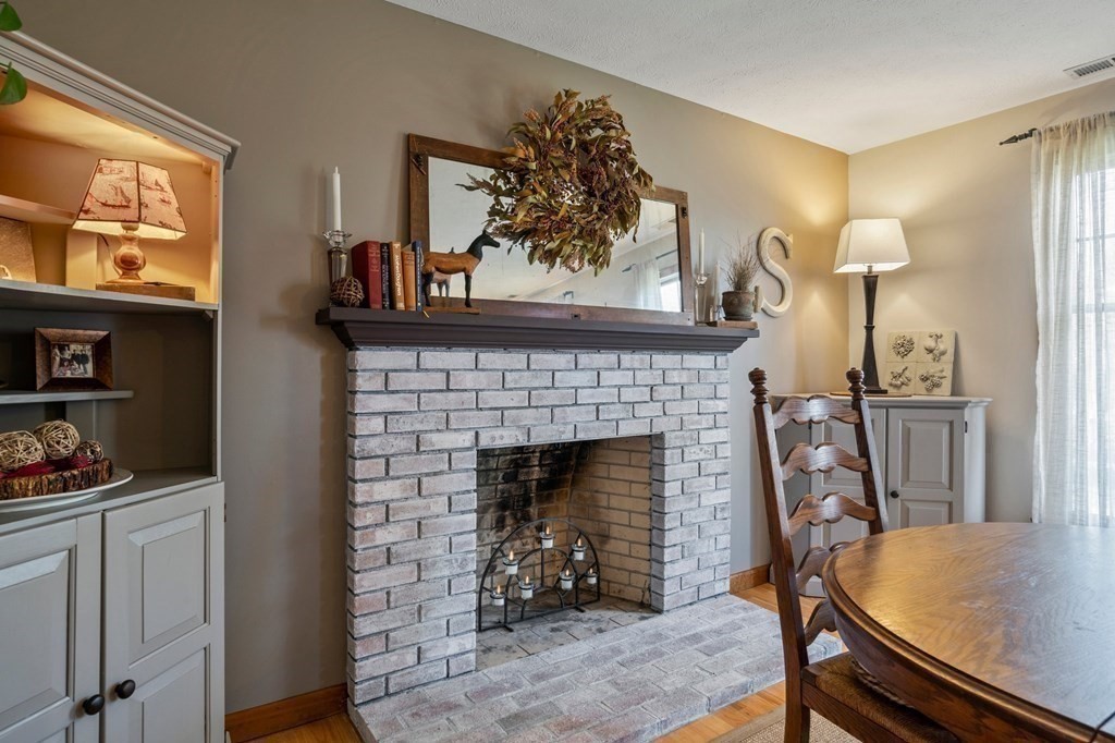 83 Thayer Road Monson, MA 01057 - Photo 26 of 42 a living room with furniture and a fireplace