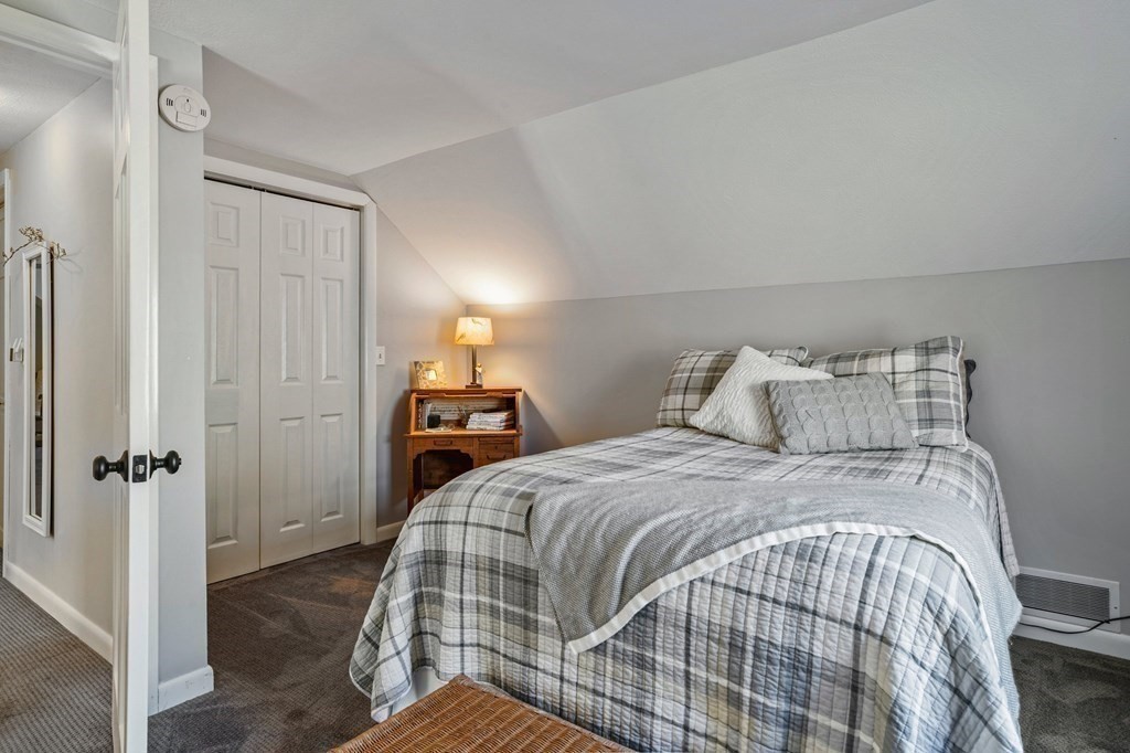 83 Thayer Road Monson, MA 01057 - Photo 36 of 42 a bedroom with a bed and wooden floor