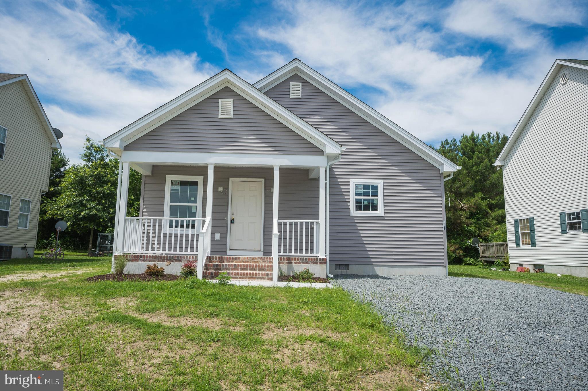 113 Morgan Run Snow Hill, MD 21863 - Photo 1 of 35 a front view of a house with a garden