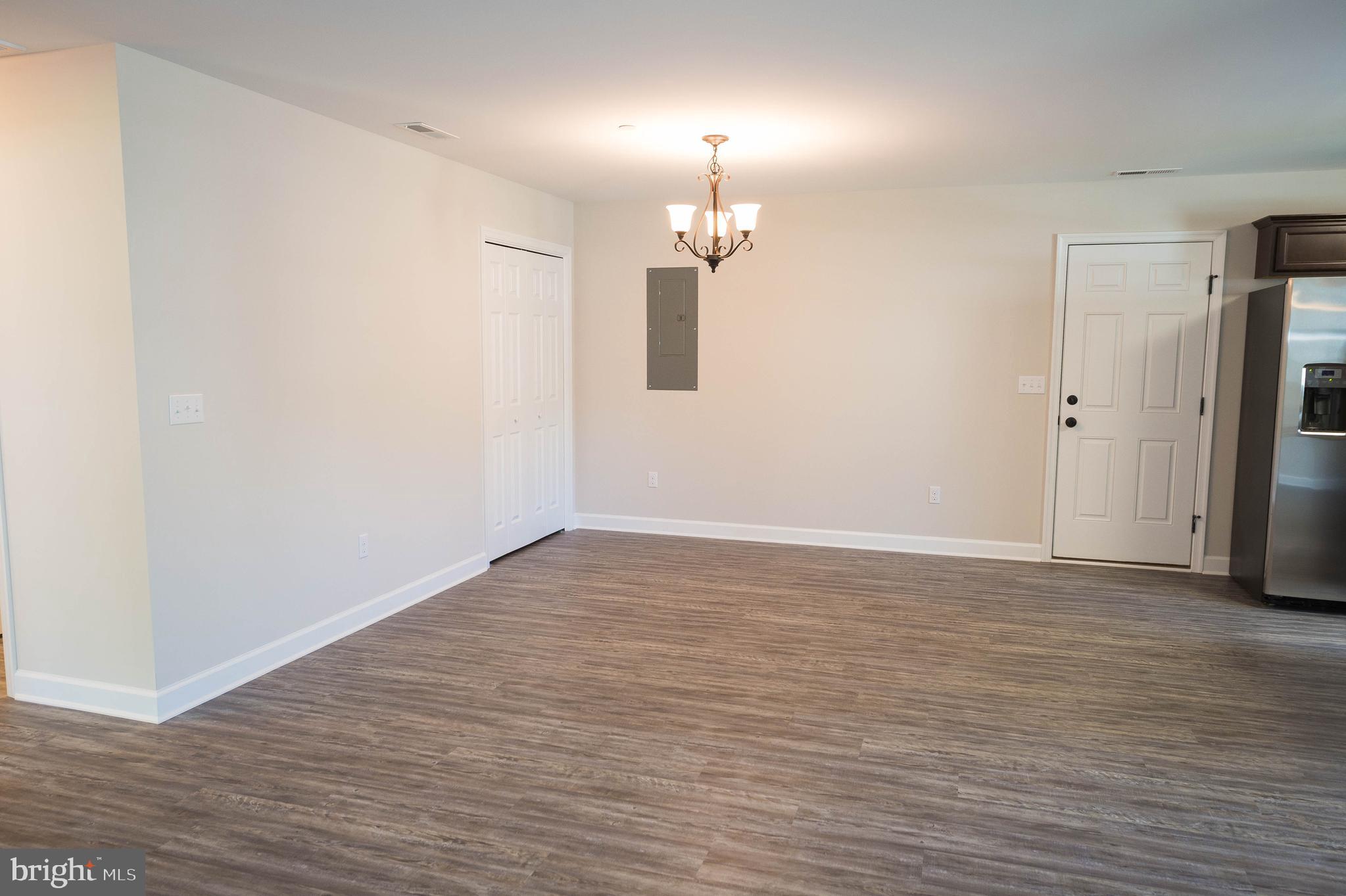 113 Morgan Run Snow Hill, MD 21863 - Photo 11 of 35 wooden floor in an empty room with a window