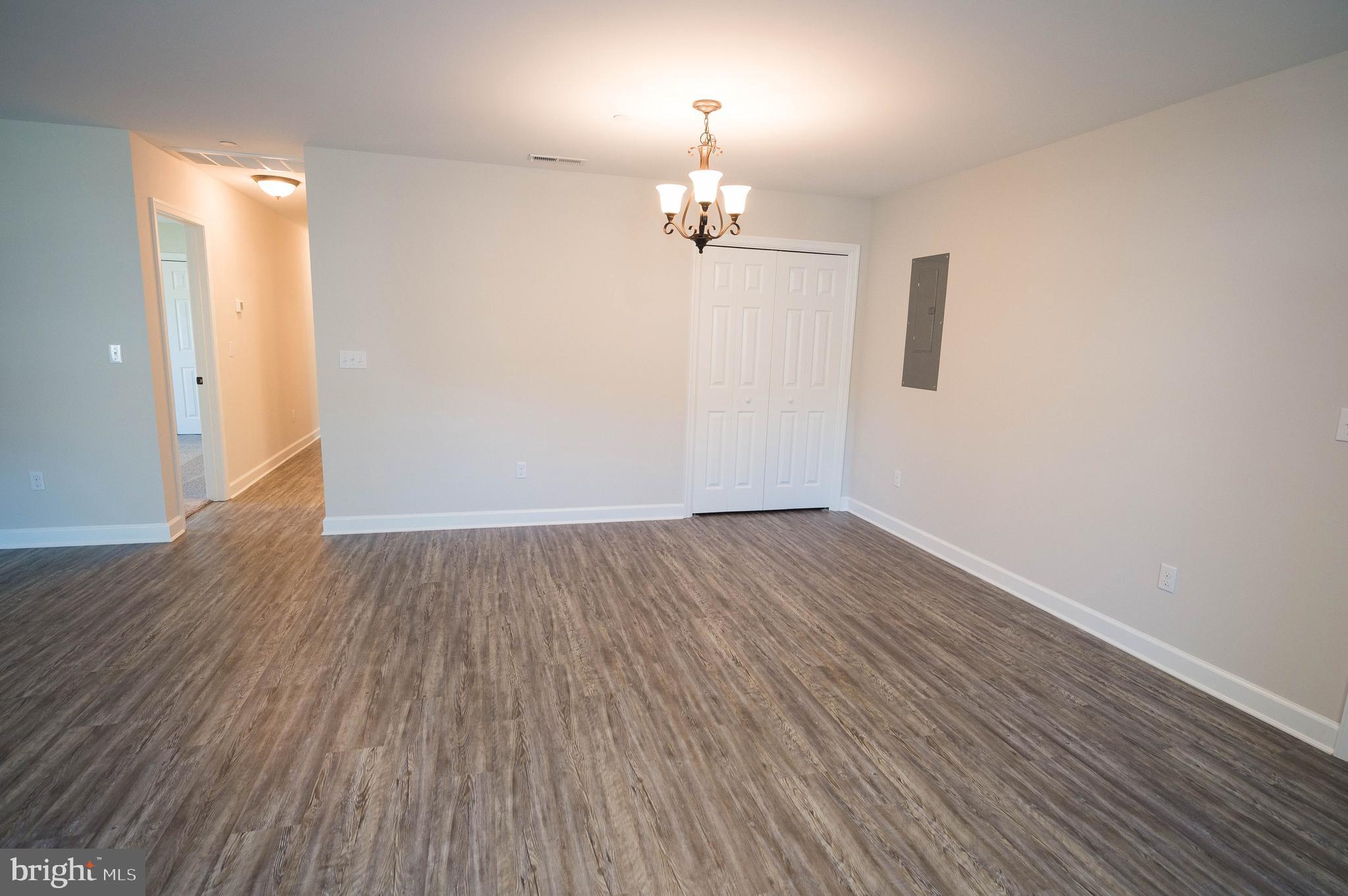 113 Morgan Run Snow Hill, MD 21863 - Photo 12 of 35 wooden floor in an empty room with a window