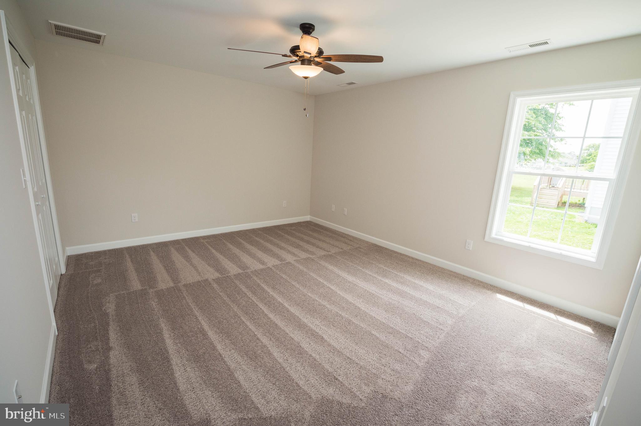 113 Morgan Run Snow Hill, MD 21863 - Photo 15 of 35 wooden floor in an empty room with a window
