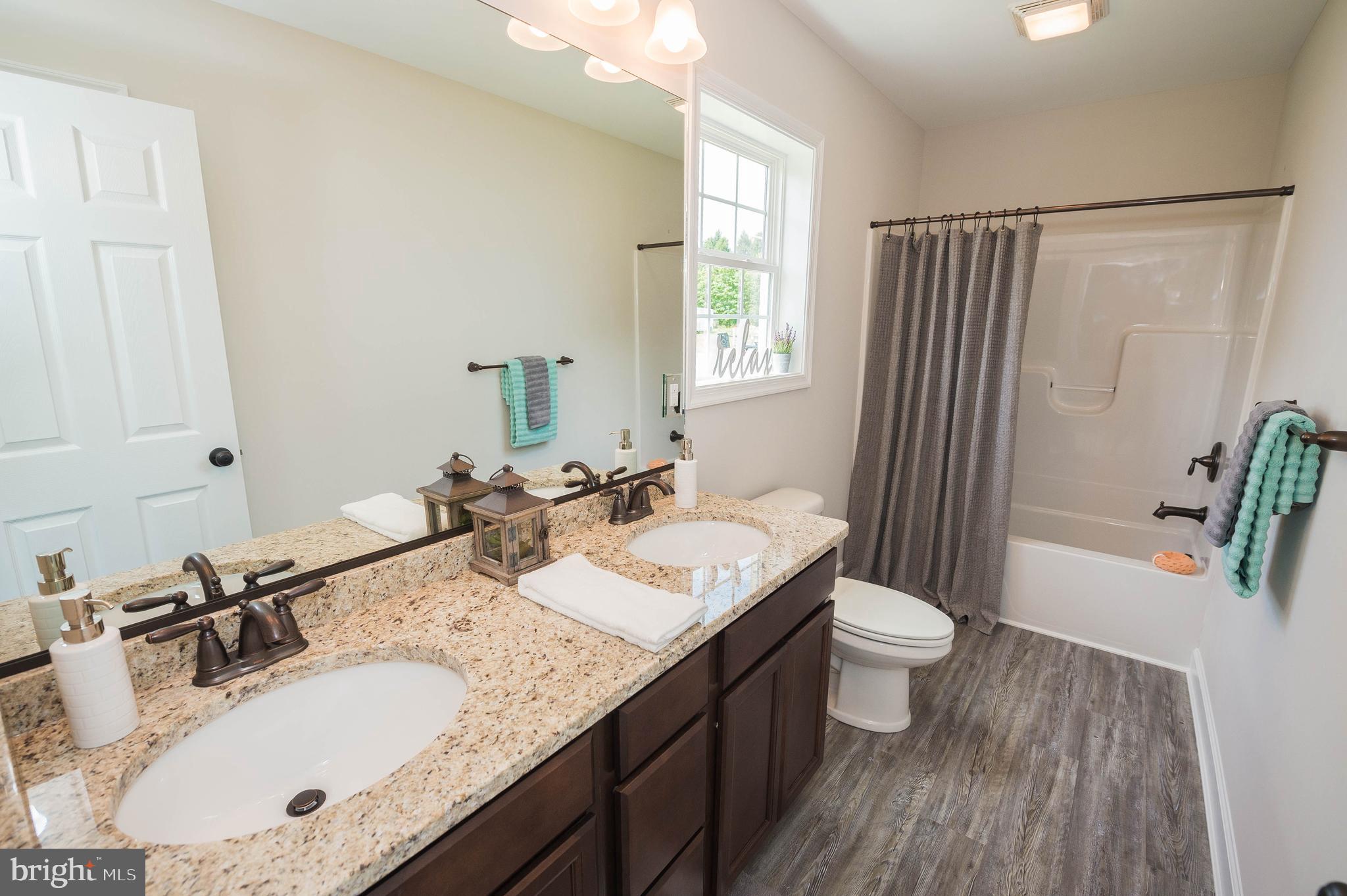 113 Morgan Run Snow Hill, MD 21863 - Photo 17 of 35 a bathroom with a granite countertop sink toilet and shower
