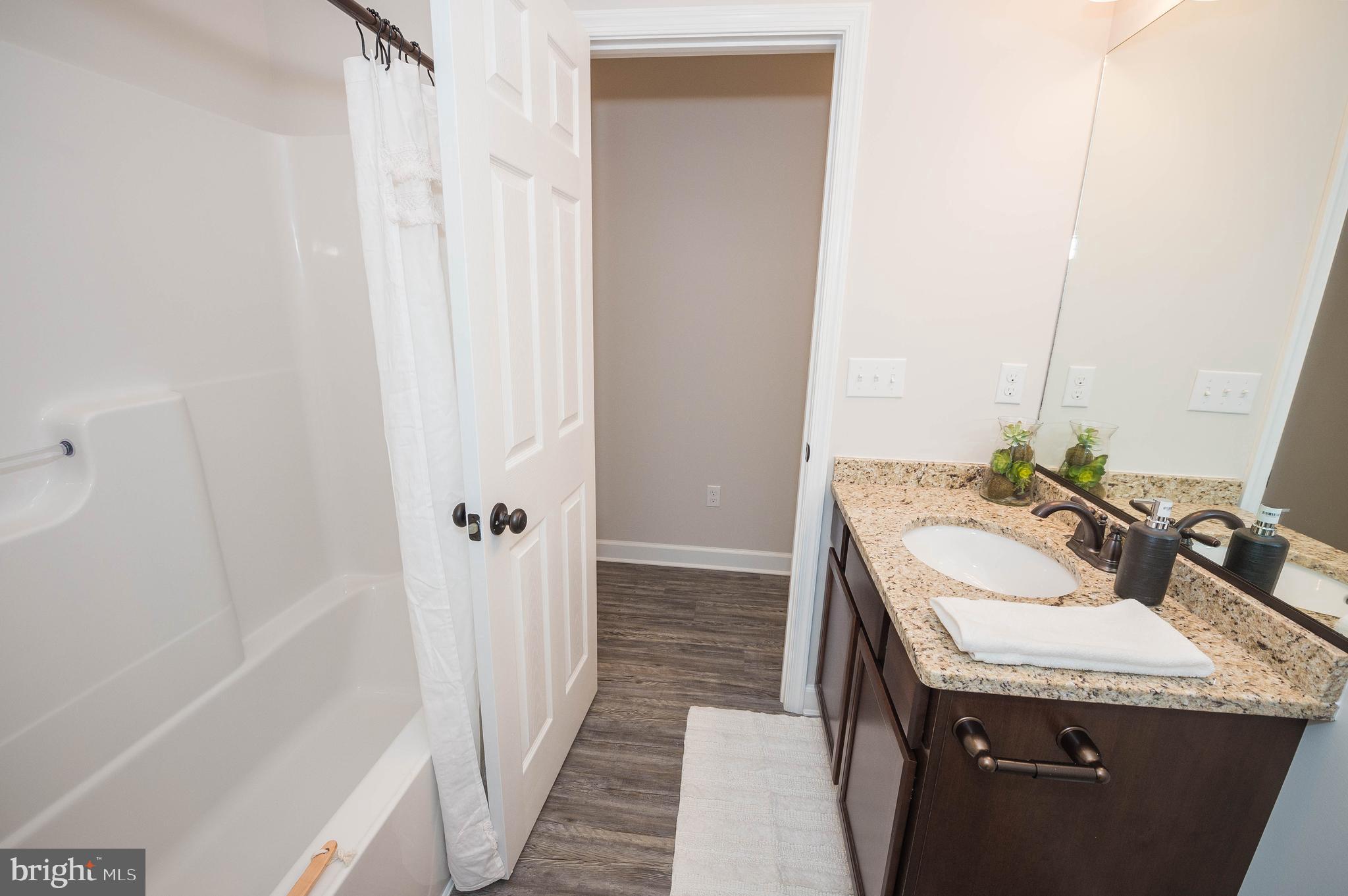 113 Morgan Run Snow Hill, MD 21863 - Photo 18 of 35 a bathroom with a sink and a mirror