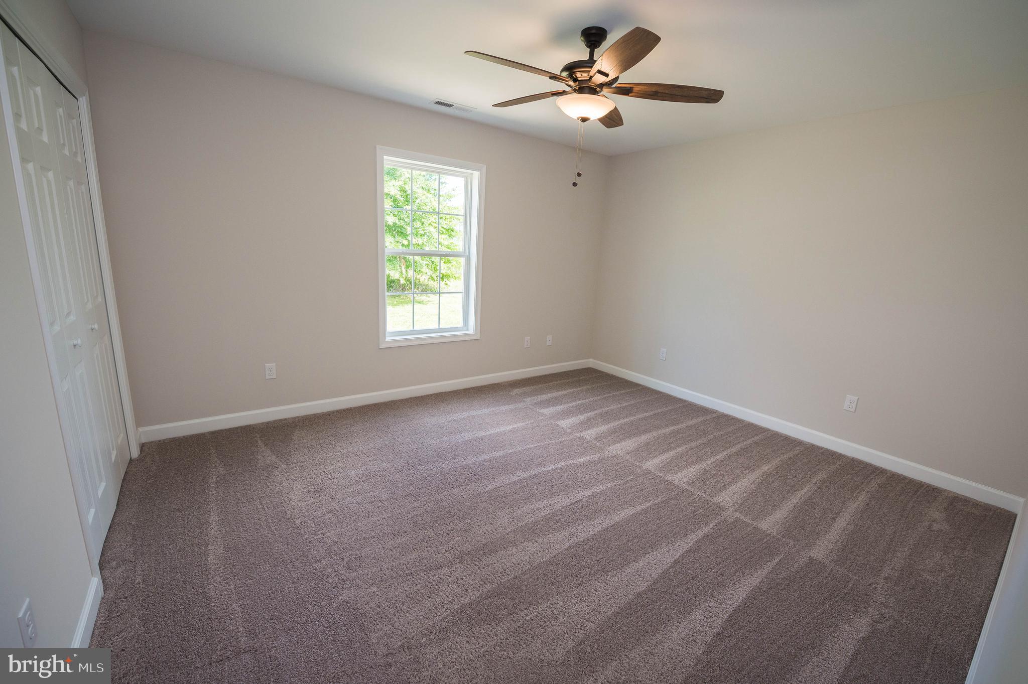 113 Morgan Run Snow Hill, MD 21863 - Photo 22 of 35 a view of room with a ceiling fan and window