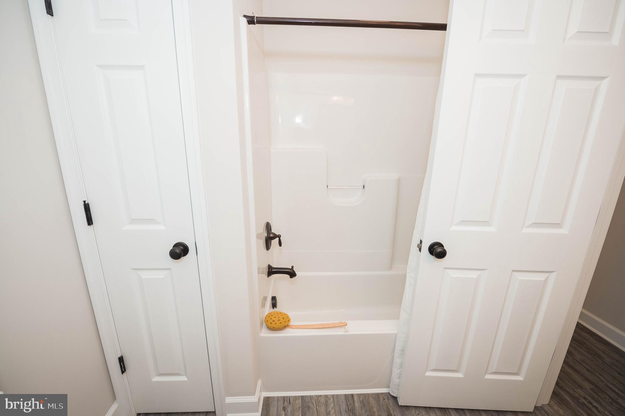 113 Morgan Run Snow Hill, MD 21863 - Photo 25 of 35 a bathroom with a bathtub and a shower