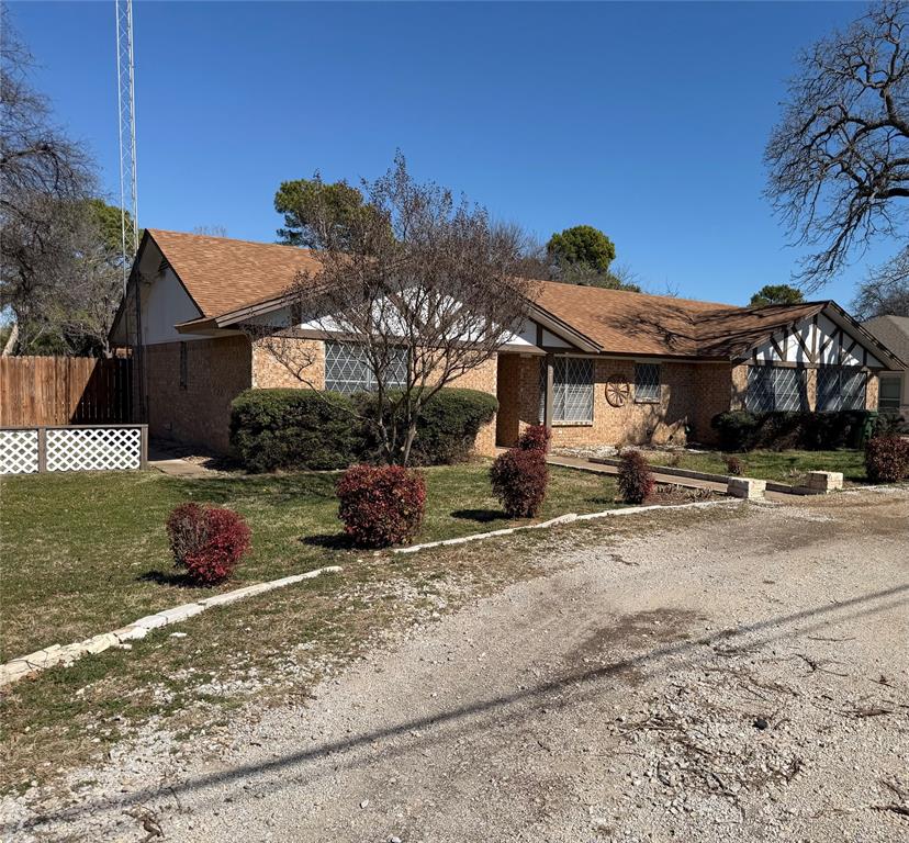 821 East Highway 199 Springtown, TX 76082 - Photo 1 of 26 a front view of a house with a yard