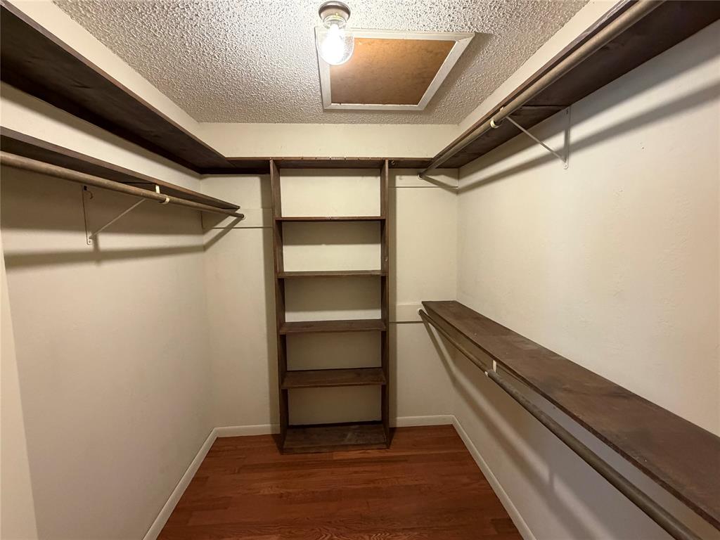 821 East Highway 199 Springtown, TX 76082 - Photo 13 of 26 a view of room with wooden floor
