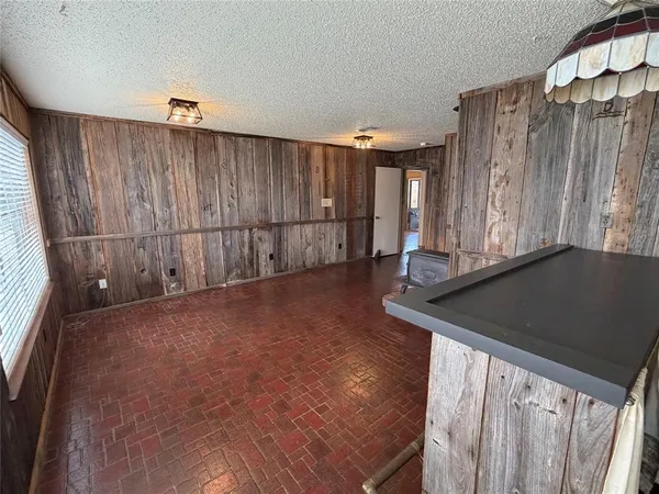 a view of a room with wooden walls