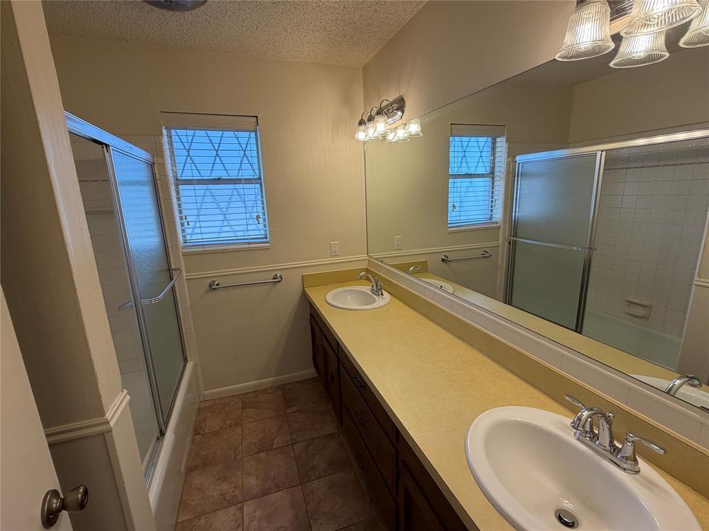 821 East Highway 199 Springtown, TX 76082 - Photo 20 of 26 a bathroom with a sink and a tub