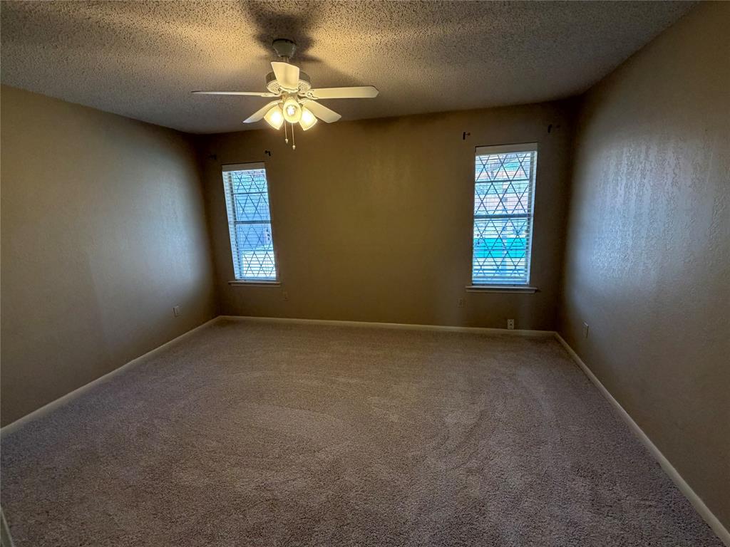 821 East Highway 199 Springtown, TX 76082 - Photo 21 of 26 an empty room with a window