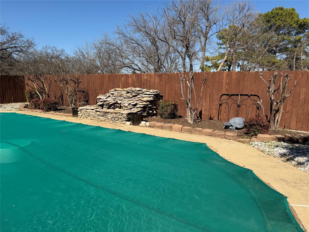 821 East Highway 199 Springtown, TX 76082 - Photo 24 of 26 a view of a backyard with large tree