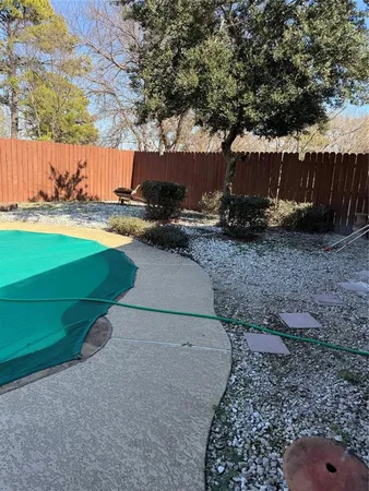 a view of backyard with green space
