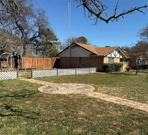 a view of a large house with a yard