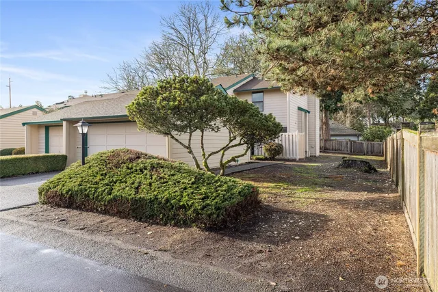 a house with a tree in front of it