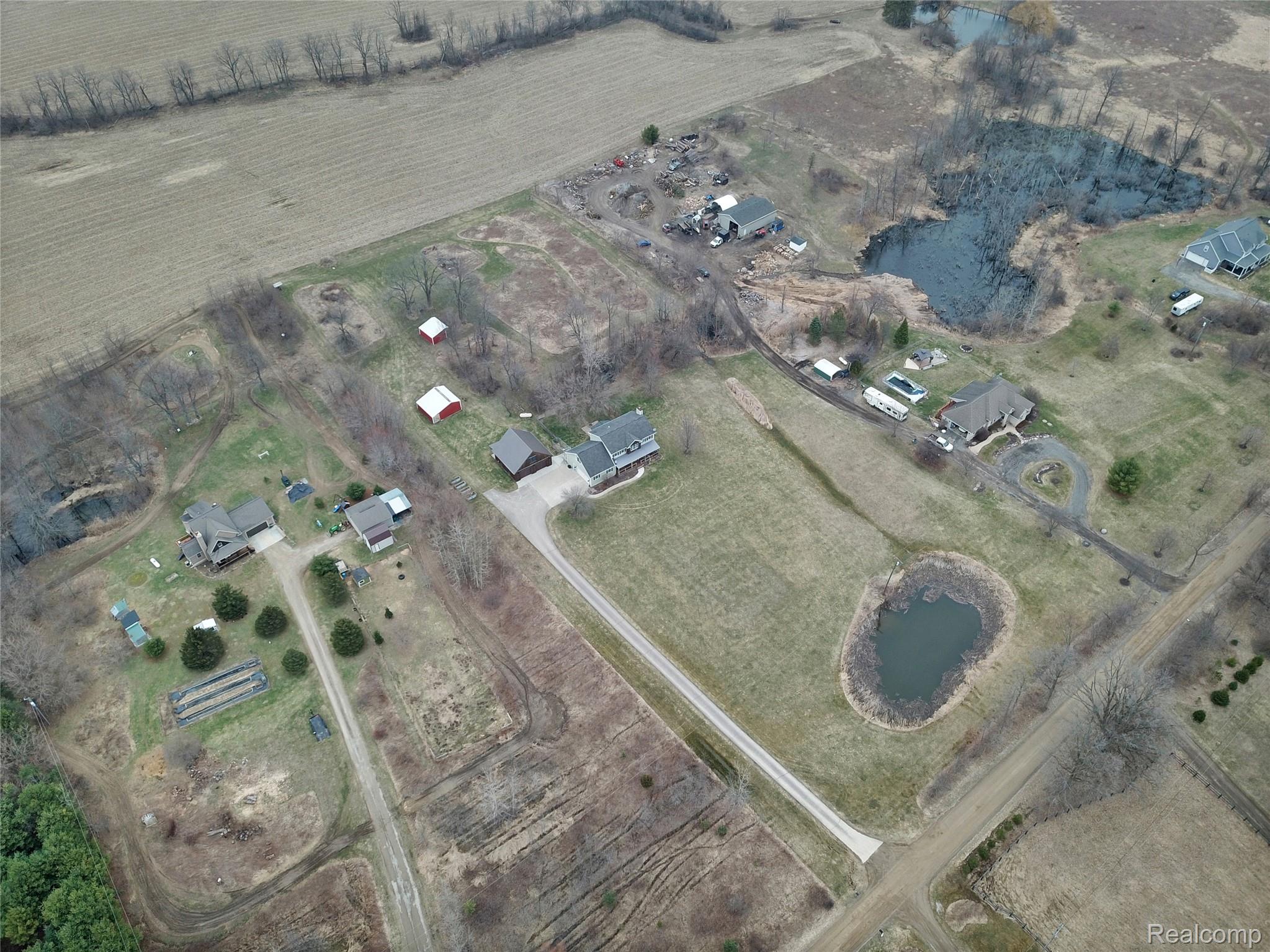 3690 Brauer Road Oxford, MI 48371 - Photo 55 of 63 Aerial view of property and surrounding area with rural landscape and a nearby body of water