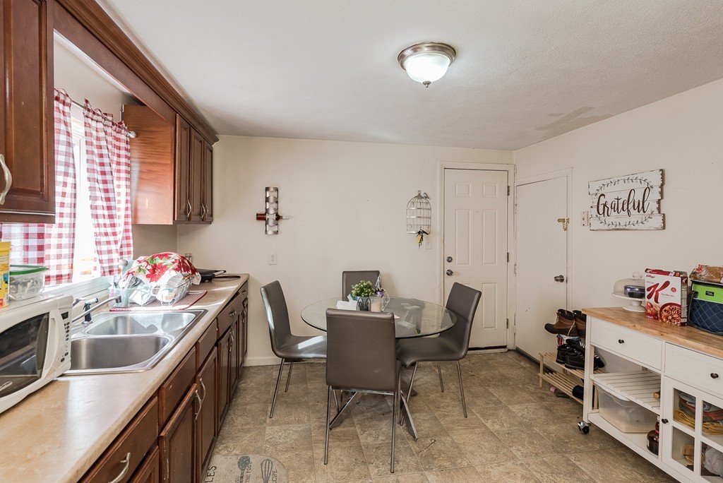 14 Chatham Road Everett, MA 02149 - Photo 6 of 10 a view of a kitchen and dining room