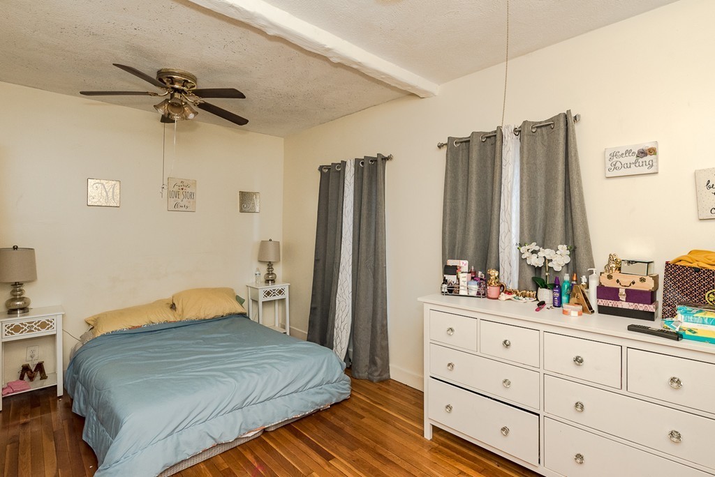 14 Chatham Road Everett, MA 02149 - Photo 8 of 10 a bedroom with a bed and a dresser