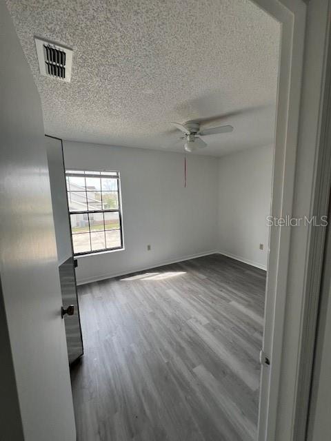 2927 Rio Grande Trail, Unit 2927 Kissimmee, FL 34741 - Photo 4 of 11 wooden floor in an empty room