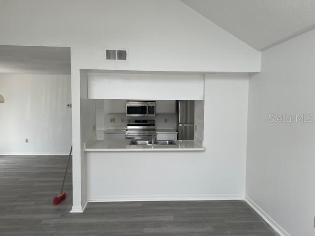 2927 Rio Grande Trail, Unit 2927 Kissimmee, FL 34741 - Photo 6 of 11 a view of microwave and stove