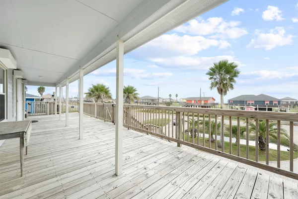 a view of a balcony with wooden floor