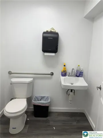 a bathroom with a sink toilet and vanity