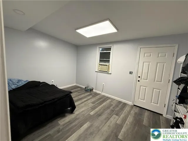 a bedroom with a bed and a dresser