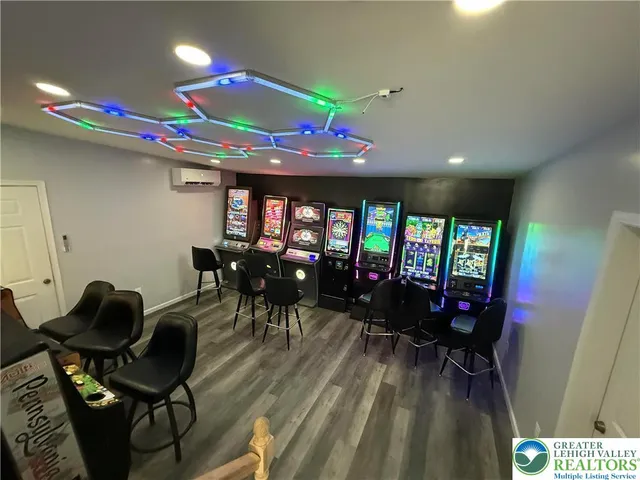 a dining room with furniture and a floor to ceiling window