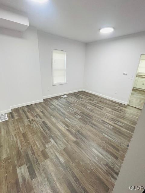 281 5th Street Whitehall, PA 18052 - Photo 11 of 36 an empty room with wooden floor and windows