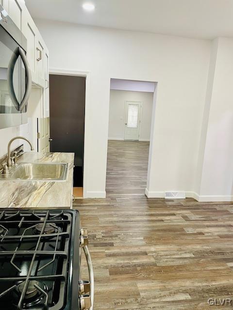 281 5th Street Whitehall, PA 18052 - Photo 15 of 36 a kitchen with granite countertop a stove and a sink
