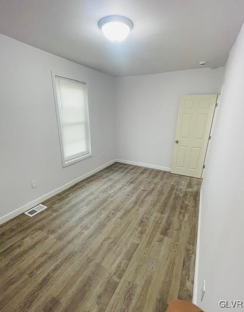 281 5th Street Whitehall, PA 18052 - Photo 23 of 36 an empty room with wooden floor and windows