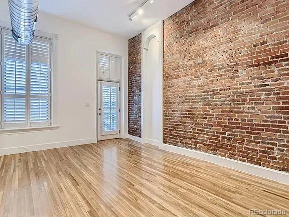 a bathroom with a double vanity sink a mirror and shower