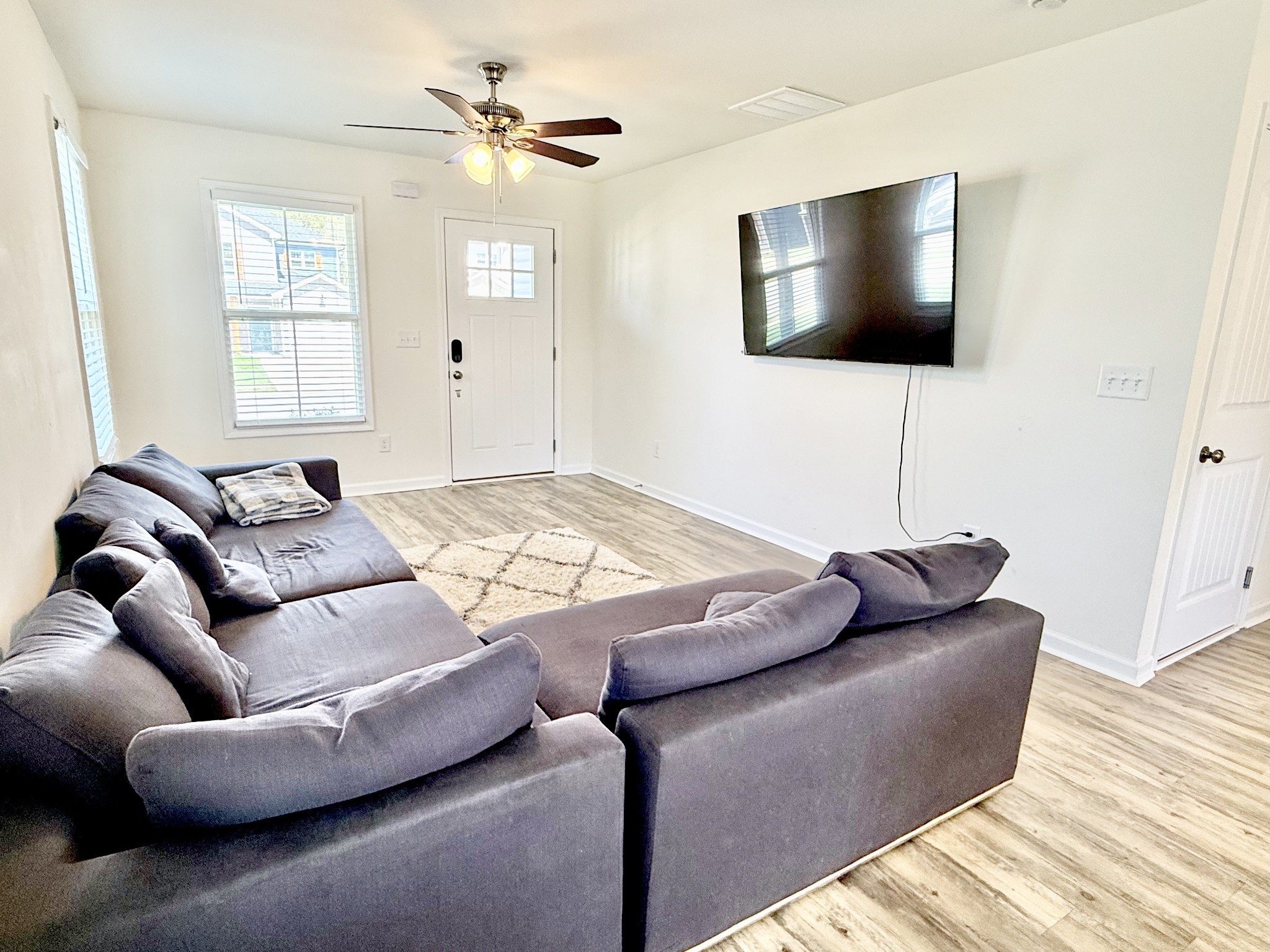 144 Quarry Rdg Road Clarksville, TN 37043 - Photo 2 of 10 a living room with furniture and a flat screen tv