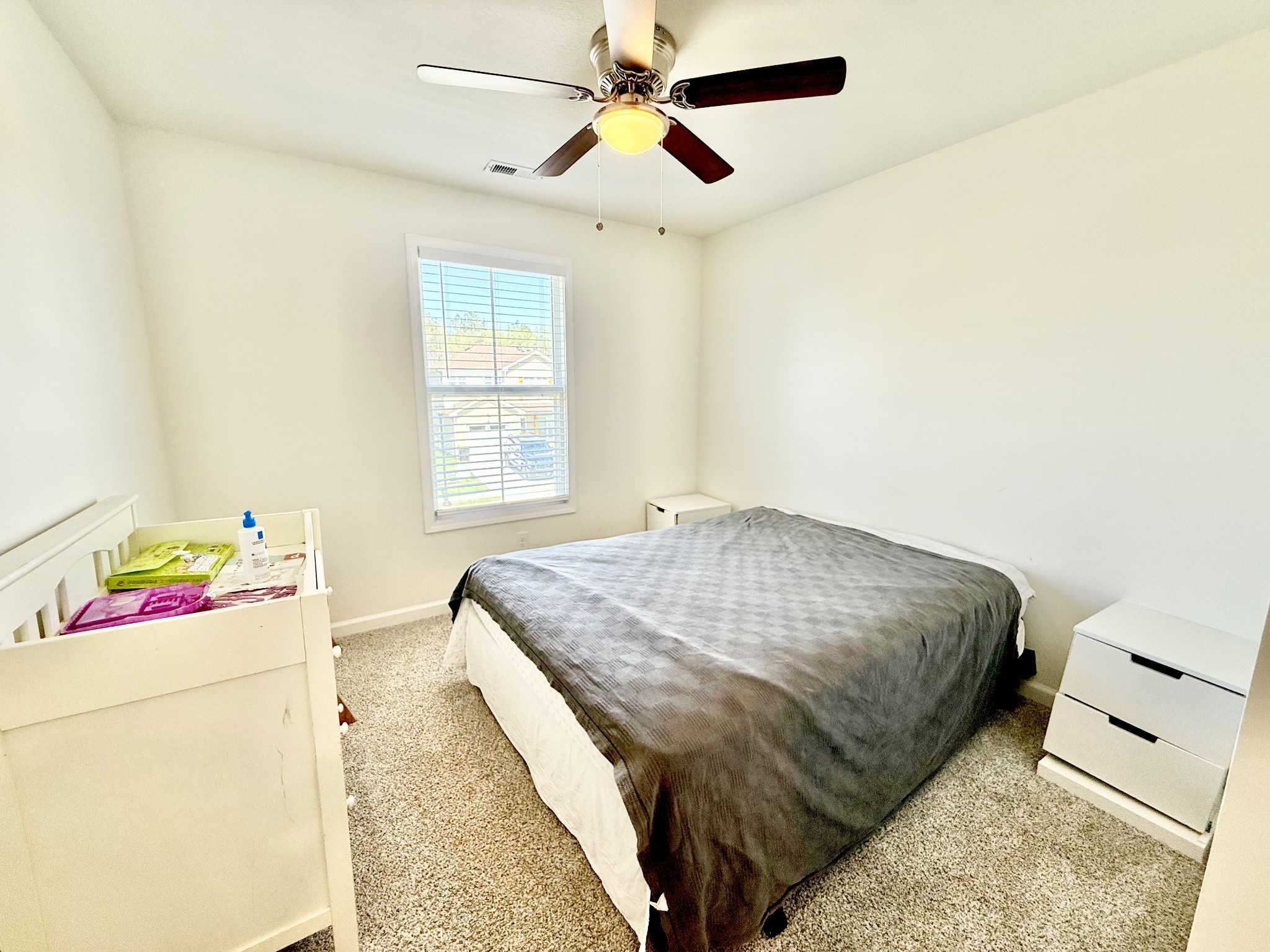 144 Quarry Rdg Road Clarksville, TN 37043 - Photo 9 of 10 a bedroom with a bed and a chandelier