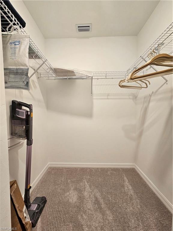 5749 Double Eagle Circle, Unit 4523 Immokalee, FL 34142 - Photo 16 of 47 a view of a room with racks on the wall