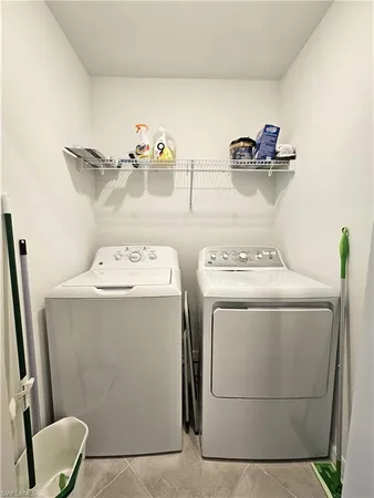a view of a dining room with furniture and window