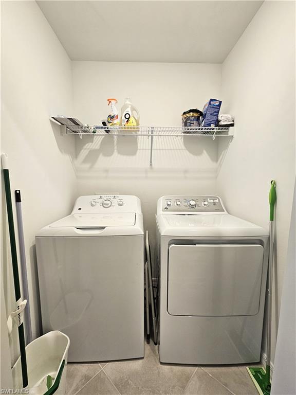 5749 Double Eagle Circle, Unit 4523 Immokalee, FL 34142 - Photo 20 of 47 a utility room with dryer and washer