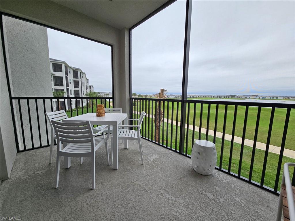 5749 Double Eagle Circle, Unit 4523 Immokalee, FL 34142 - Photo 2 of 47 a view of a chair and table in the porch