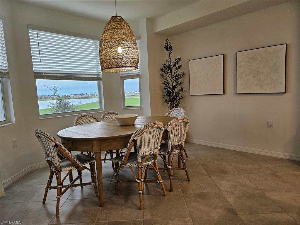 5749 Double Eagle Circle, Unit 4523 Immokalee, FL 34142 - Photo 21 of 47 a view of a dining room with furniture and window