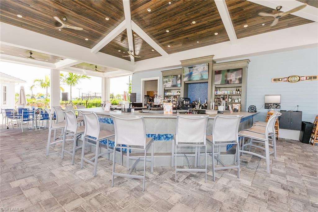 5749 Double Eagle Circle, Unit 4523 Immokalee, FL 34142 - Photo 31 of 47 a room with stainless steel appliances kitchen island granite countertop furniture and a view of kitchen