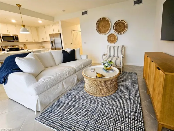 a living room with a couch and a table